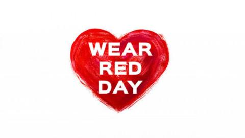 Image of a painted red heart with the words WEAR RED DAY typed in a bold white font in the center.