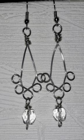 Image of the craft featuring a pair of twisted wire earrings with a dangling bead. 