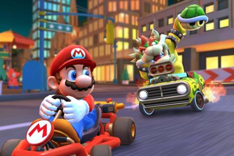 Image of Mario and Bowser of the Super Mario Brothers riding go carts, Bowser holding up a Koopa shell behind Mario.. 