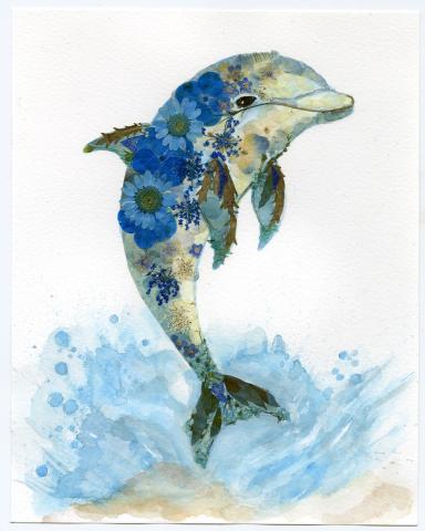 Image of the craft featuring a dolphin image made up of small colorful flowers. 