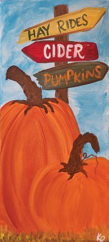 Image of a painted canvas with pumpkins and road signs made of wooden arrows.