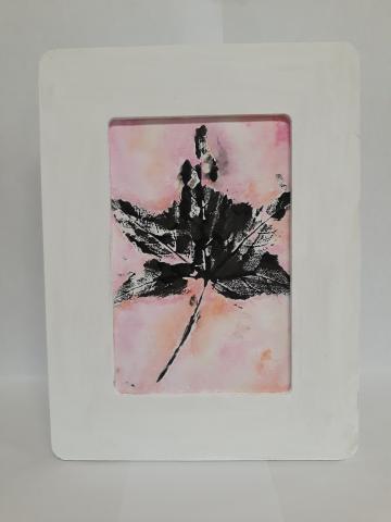 Image of the craft featuring a painted impression of a Maple leaf in a frame.