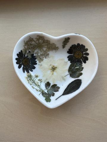 Image of the craft featuring a ceramic heart shaped bowl with decoupaged flowers.