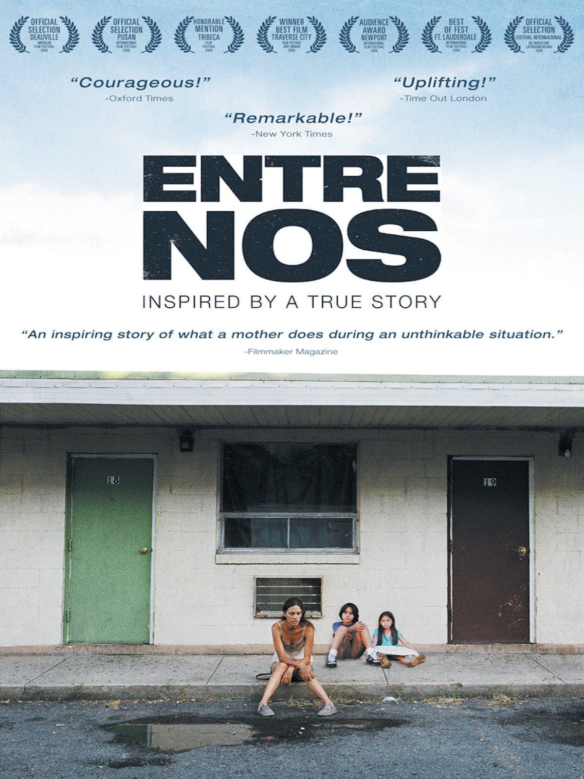 Image of Movie Poster. Woman sitting on a sidewalk curb in front of a motel building. A little boy and girl are sitting on the sidewalk behind her. 