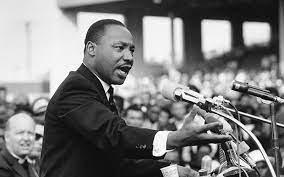 Image of Martin Luther King Jr speaking to a crowd. 