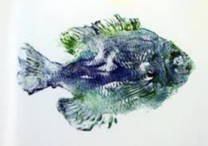 Image of a printed blue and green fish on paper.