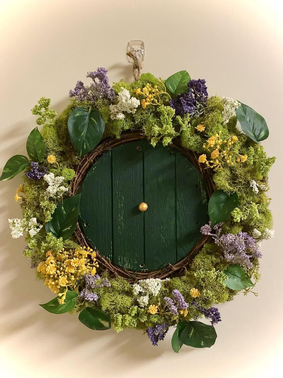 small door surrounded by greenery