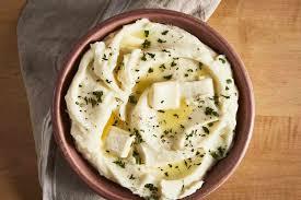 bowl of mashed potatoes with butter and chives