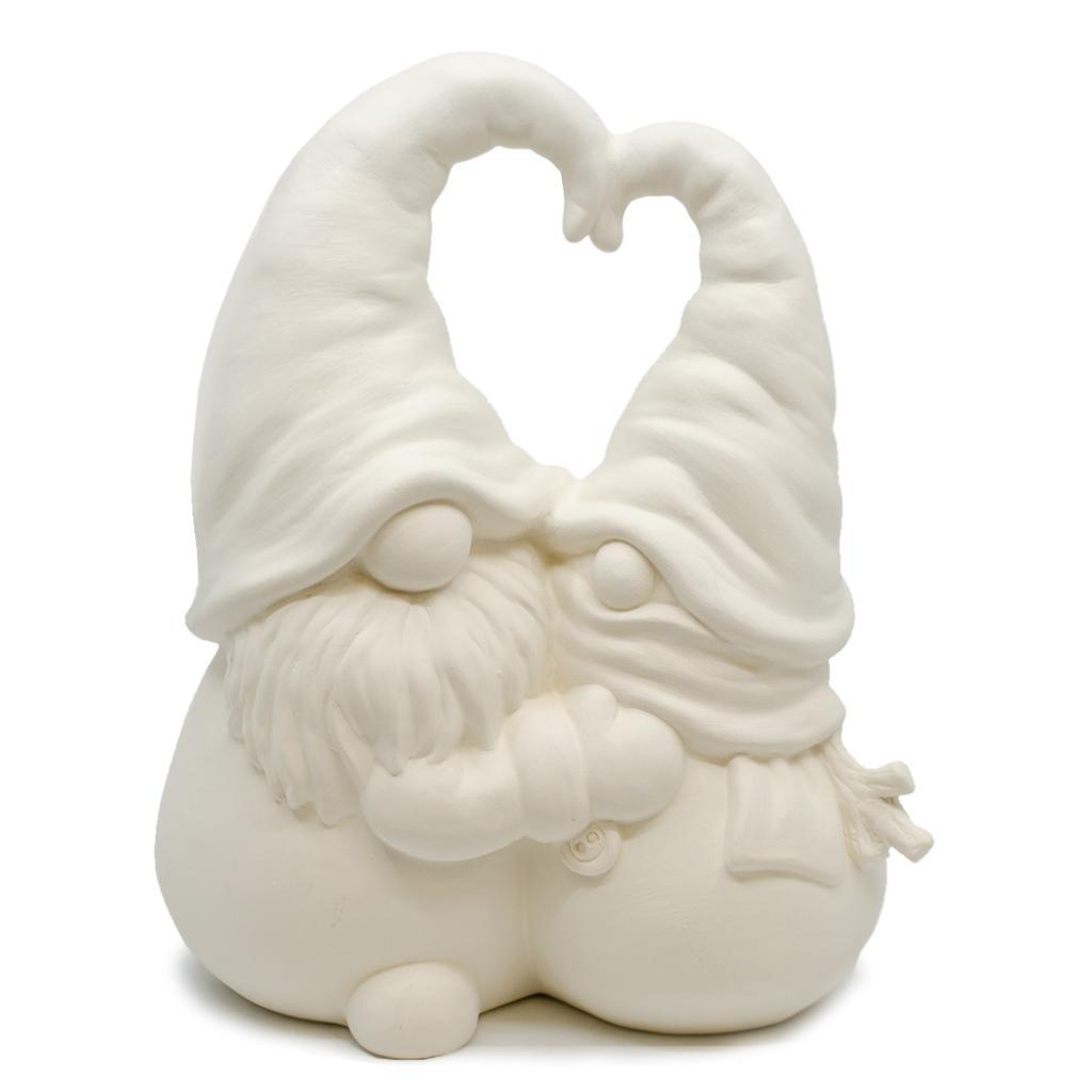 Image of 2 ceramic gnomes hugging and their hats coming together to create a heart shape. 